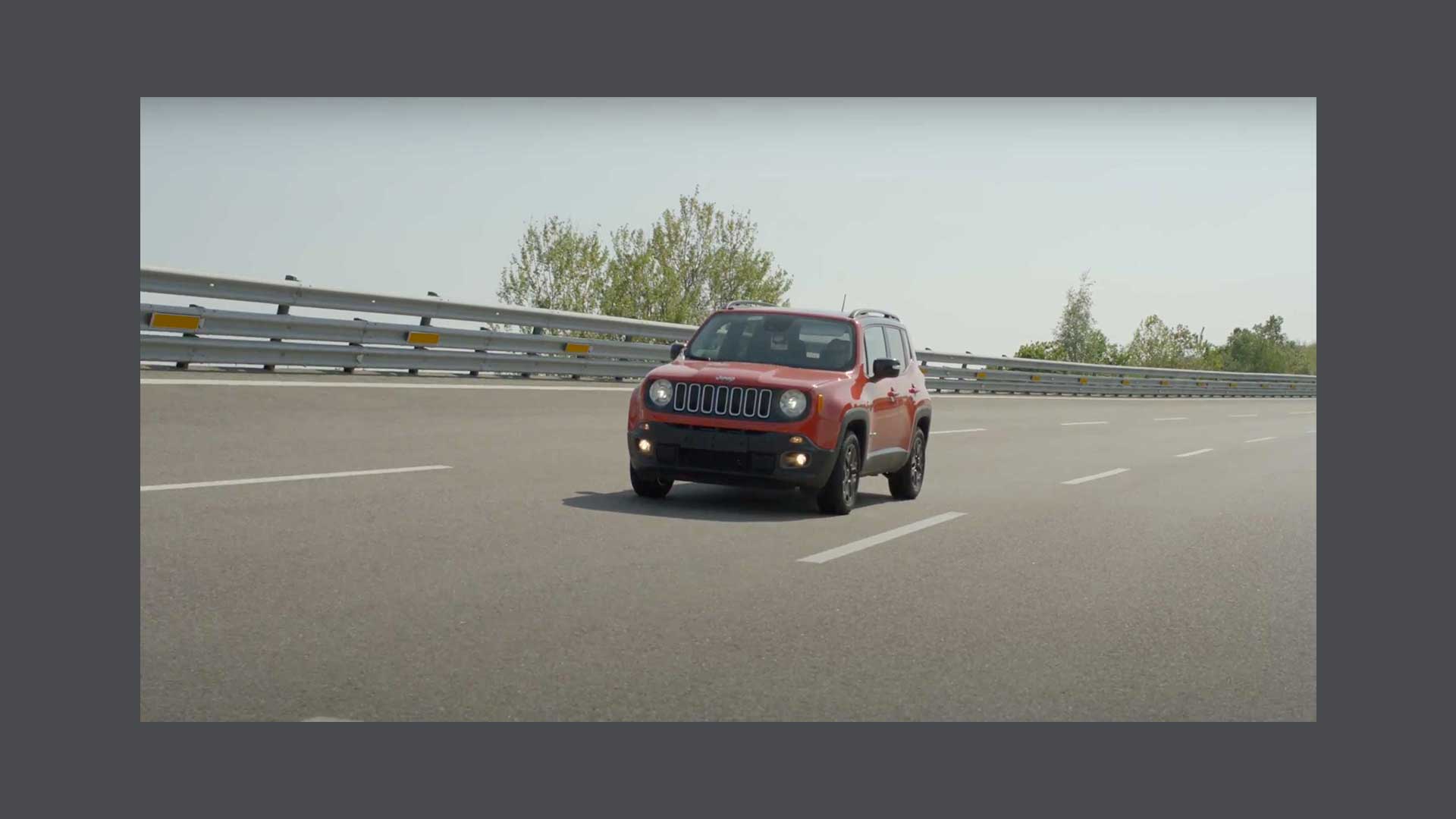 Photo of a red Alfa Romeo Stelvio on the road