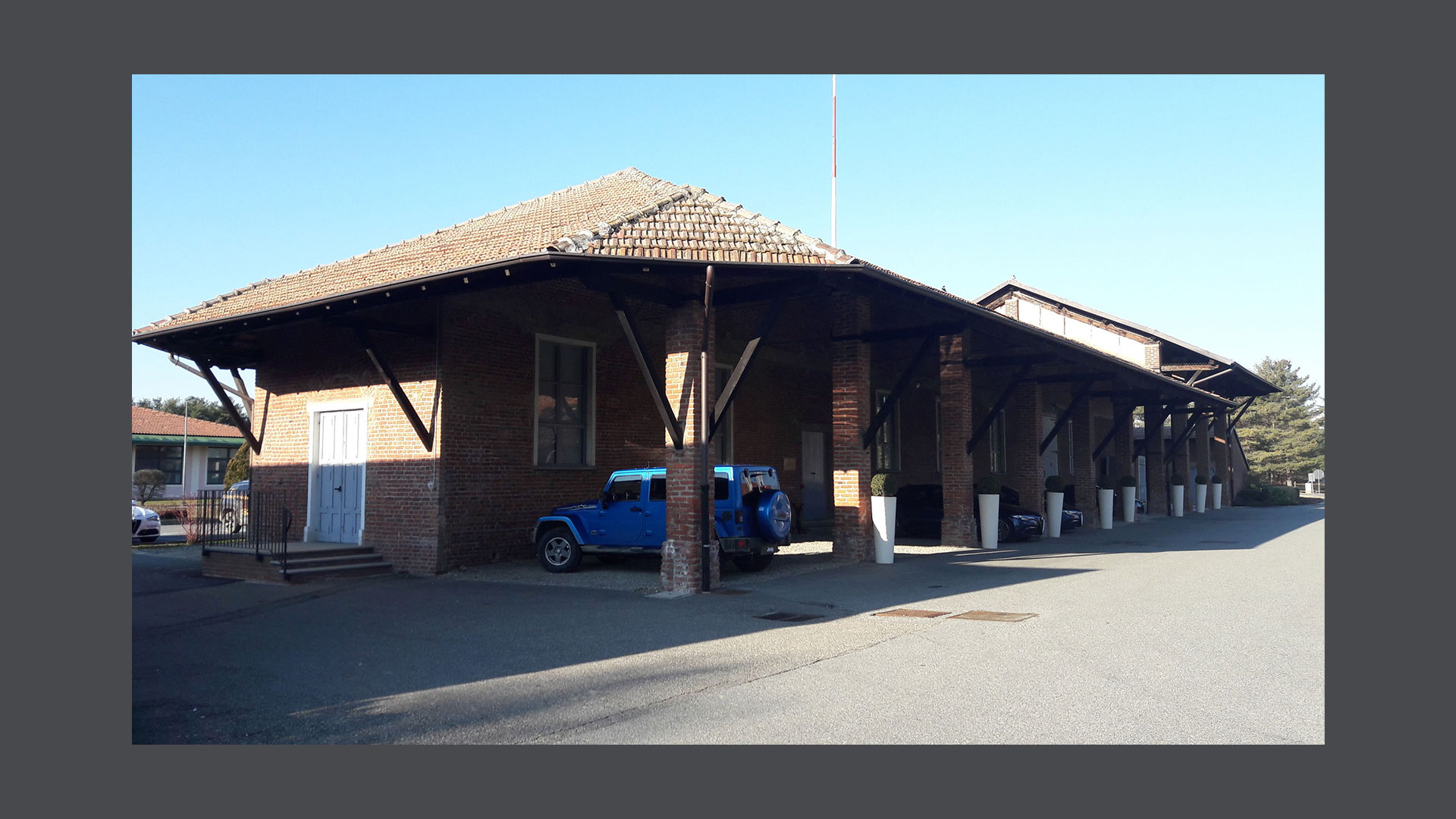 Photo of a three-quarter view of  the Autodelta porch