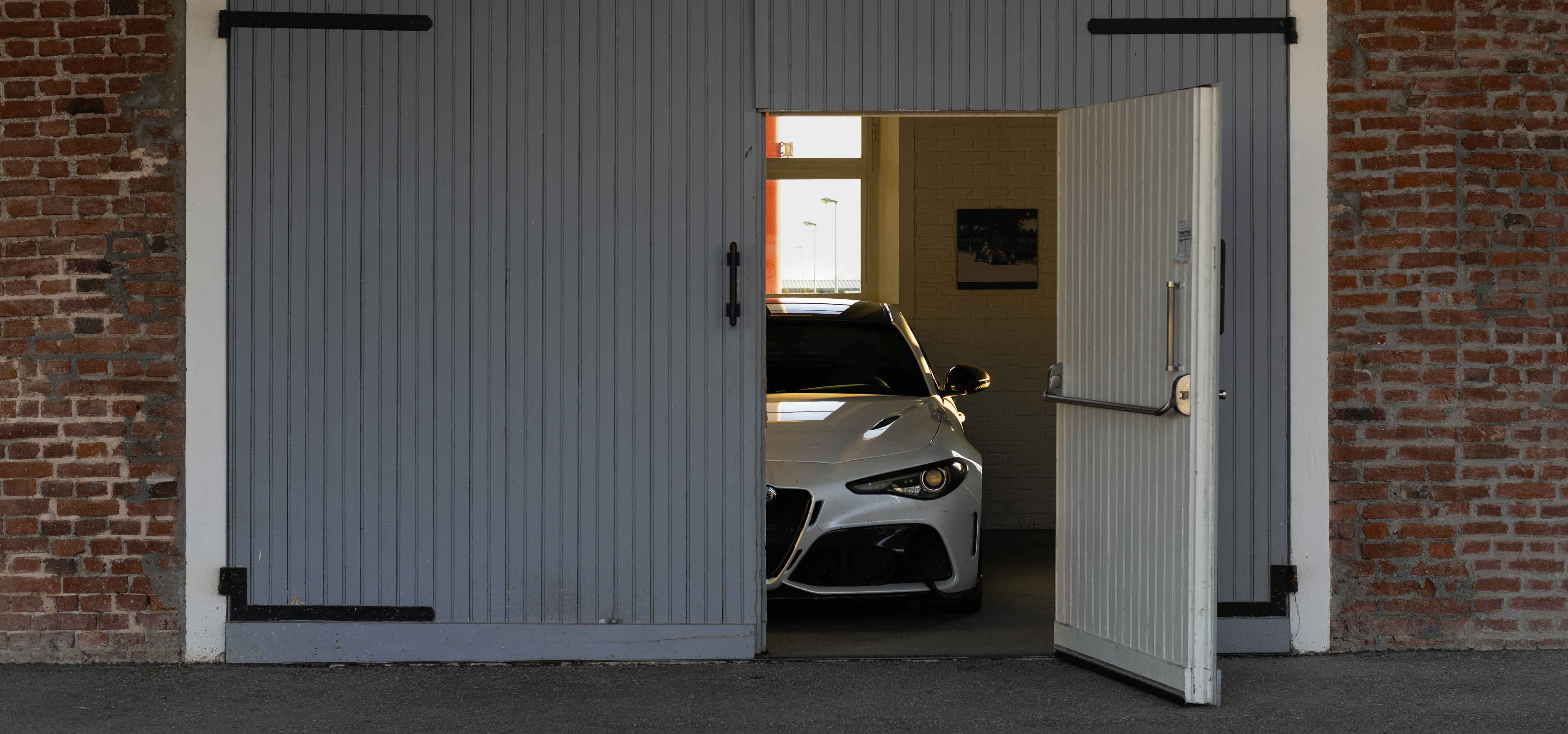 Photo of a white car inside the Autodelta