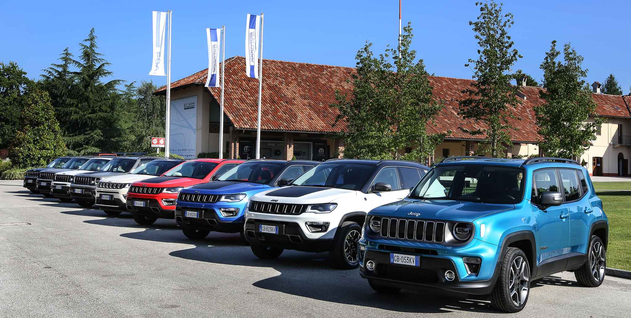 Photos of several Jeeps parked in the courtyard of the farmhouse