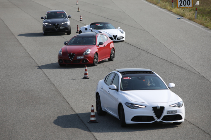 Photo of Alfa Romeo cars on the track