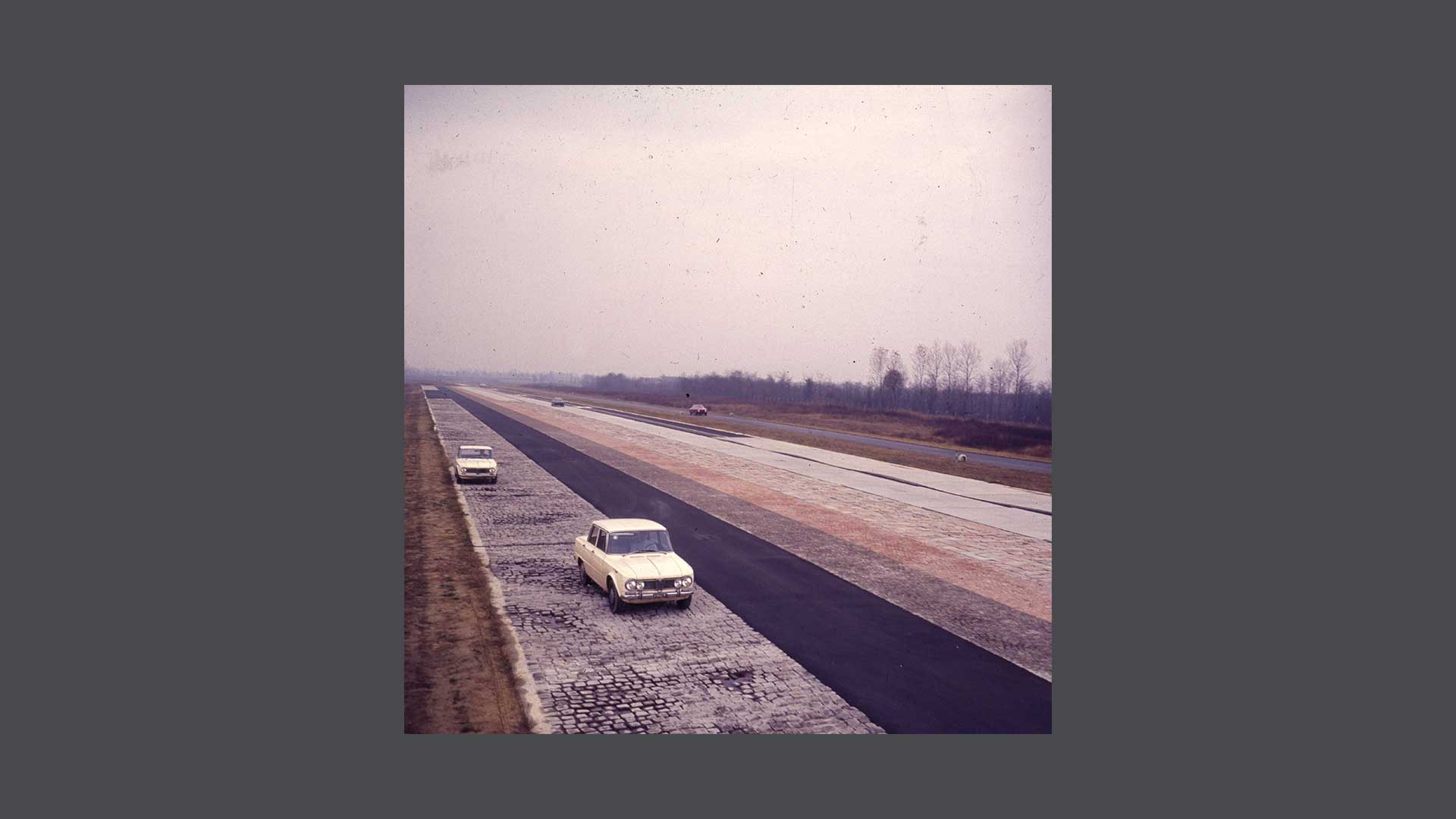 Historical photo of cars on the track