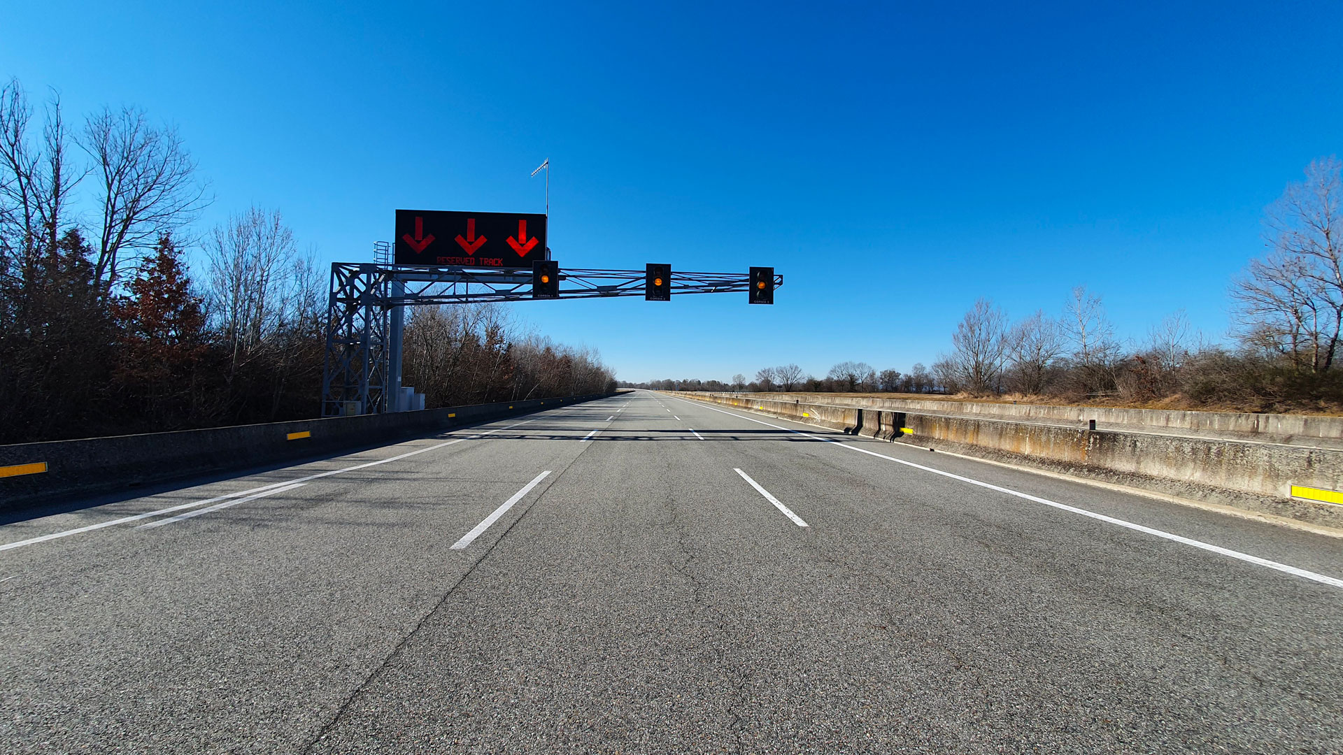 Photo of High Speed Track entrance with traffic lights and lane markings 