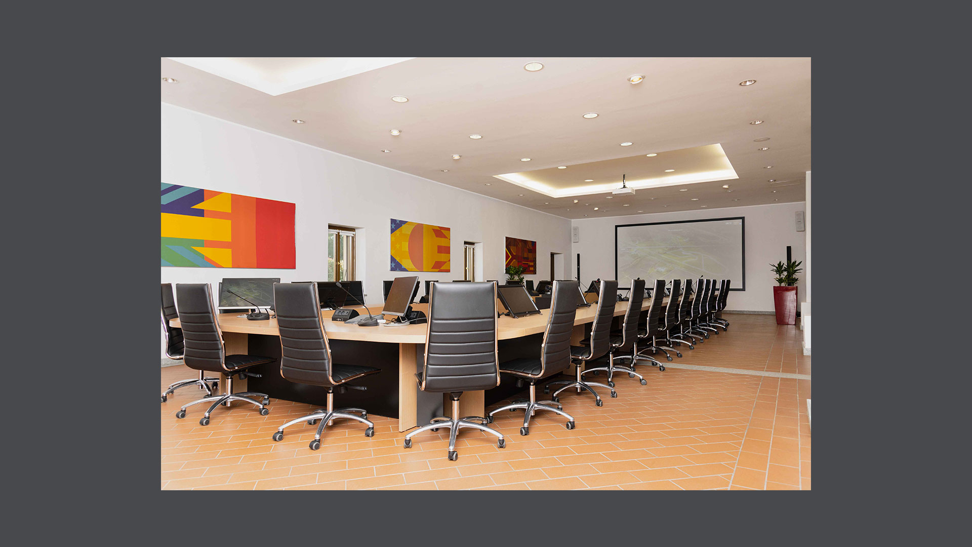 Photos of the 35-seat GEC Room, furnished in a modern and elegant style