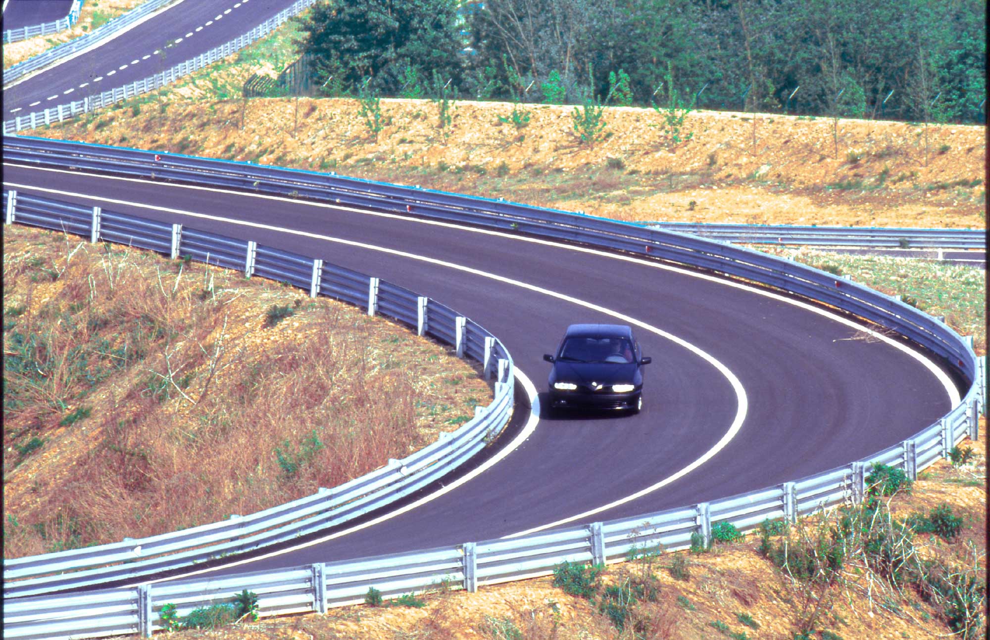 Photo of a car cornering on a track
